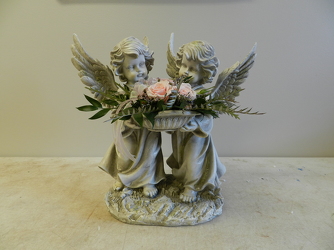 Angel statue with arr from Beck's Flower Shop & Gardens, in Jackson, Michigan