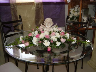 Angelic table arrangement from Beck's Flower Shop & Gardens, in Jackson, Michigan